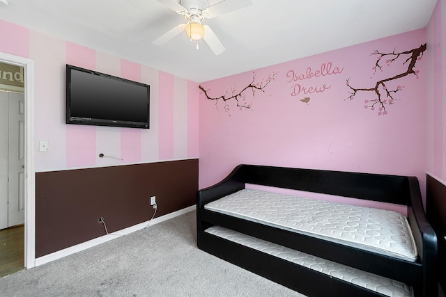 carpeted bedroom featuring baseboards, a ceiling fan, and wallpapered walls