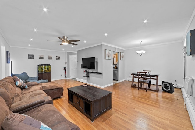 living area with baseboards, ceiling fan with notable chandelier, recessed lighting, and light wood-style floors