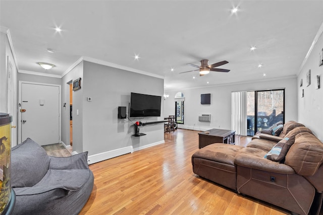 living room featuring light wood-style floors, ceiling fan, baseboards, and ornamental molding