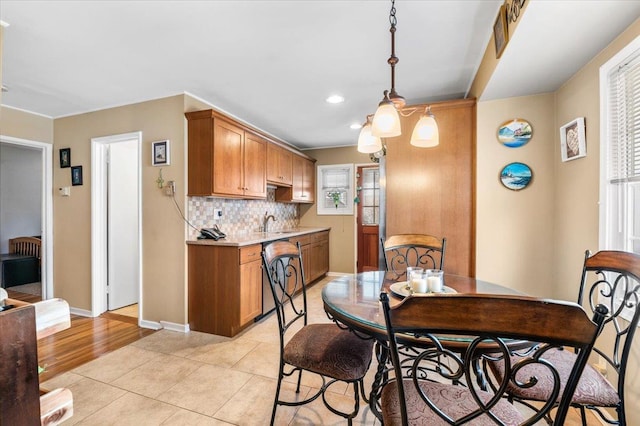 dining area with recessed lighting, baseboards, and light tile patterned floors