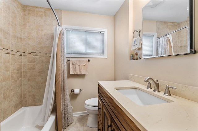 bathroom featuring a wealth of natural light, toilet, shower / bath combo, vanity, and tile patterned floors