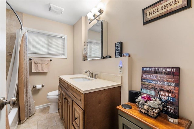 full bathroom with toilet, vanity, baseboards, a shower with curtain, and tile patterned floors