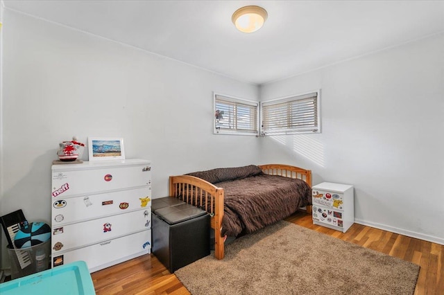 bedroom with wood finished floors