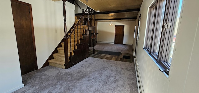 carpeted foyer entrance featuring a baseboard heating unit, wooden ceiling, beamed ceiling, and stairs