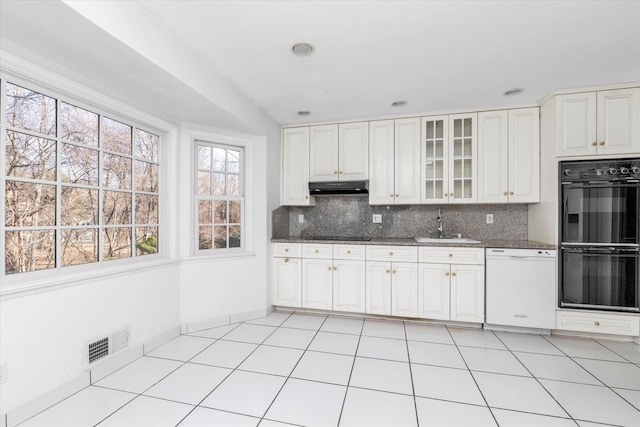 kitchen with visible vents, dobule oven black, decorative backsplash, dishwasher, and under cabinet range hood