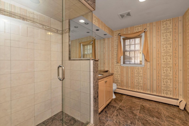 full bath with visible vents, baseboard heating, vanity, a shower stall, and wallpapered walls