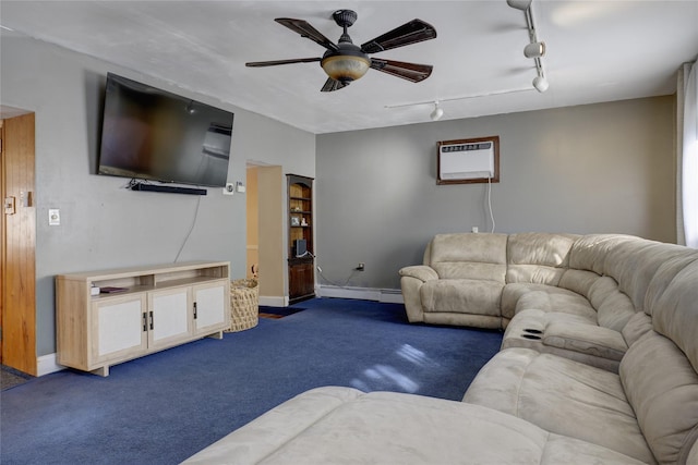 carpeted living room with a wall unit AC, rail lighting, baseboards, and a ceiling fan