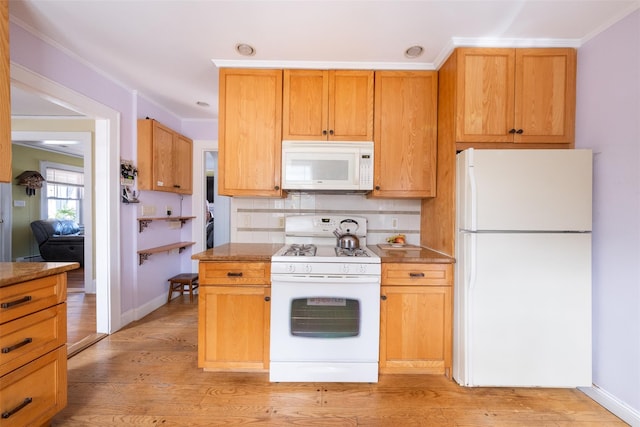 kitchen featuring white appliances, baseboards, decorative backsplash, light wood finished floors, and crown molding