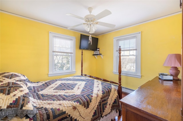 bedroom featuring ornamental molding and a ceiling fan