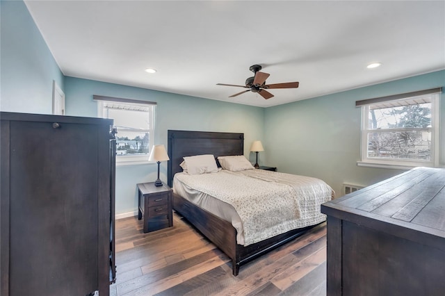 bedroom with ceiling fan, baseboards, dark wood-type flooring, and recessed lighting