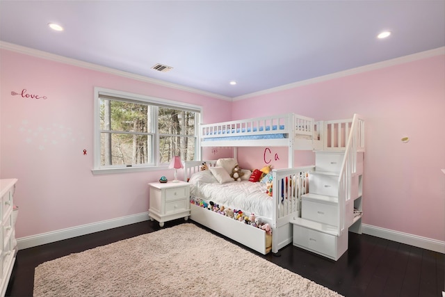 bedroom featuring baseboards, visible vents, dark wood finished floors, crown molding, and recessed lighting