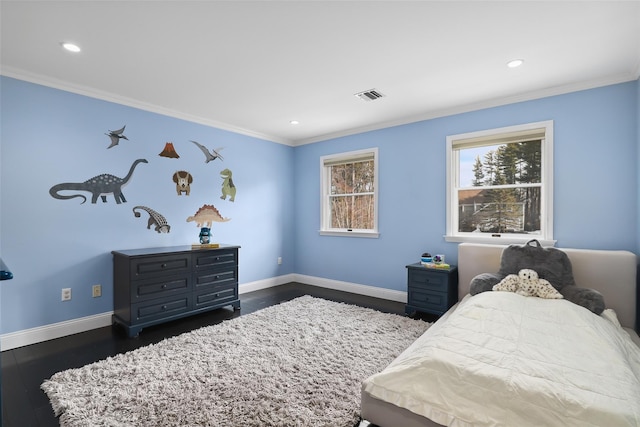 bedroom featuring dark wood-style floors, visible vents, ornamental molding, and baseboards