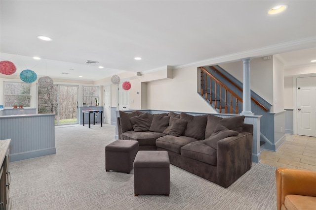 living area featuring visible vents, stairs, ornamental molding, and recessed lighting