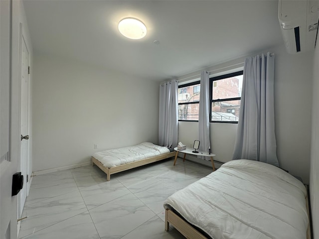 bedroom featuring marble finish floor and baseboards