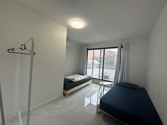 bedroom with marble finish floor, baseboards, and a wall mounted AC