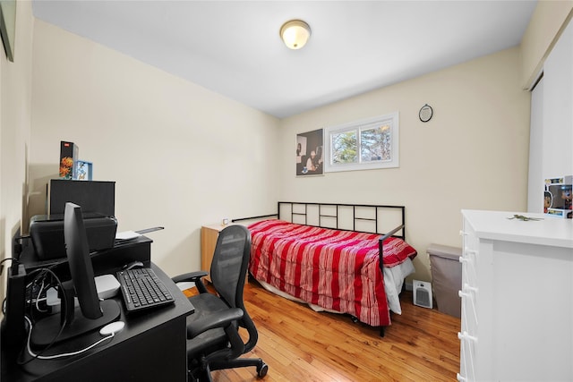 bedroom featuring light wood finished floors