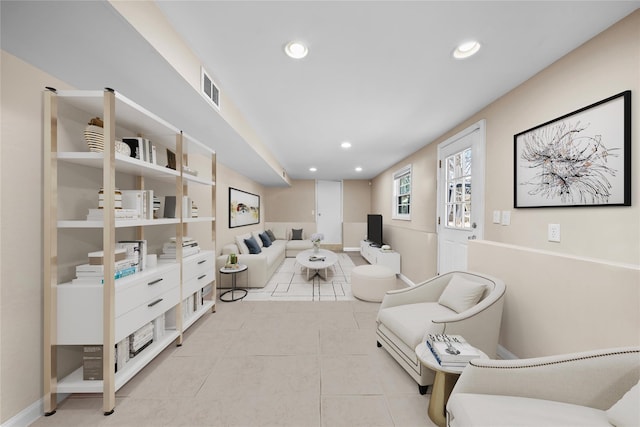 sitting room with tile patterned flooring, visible vents, baseboards, and recessed lighting