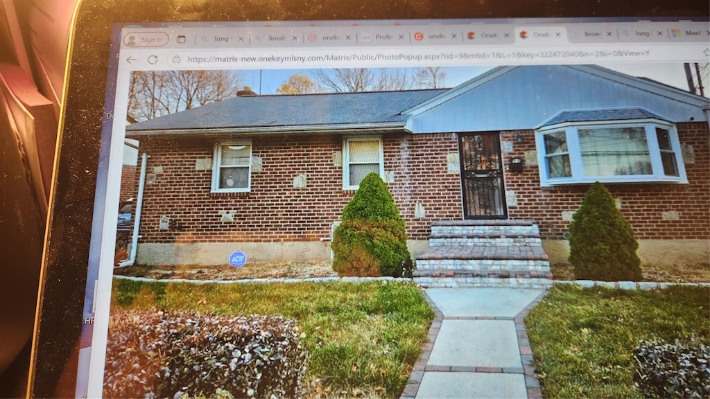 view of front of property with brick siding