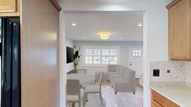 interior space featuring light wood-style floors and recessed lighting