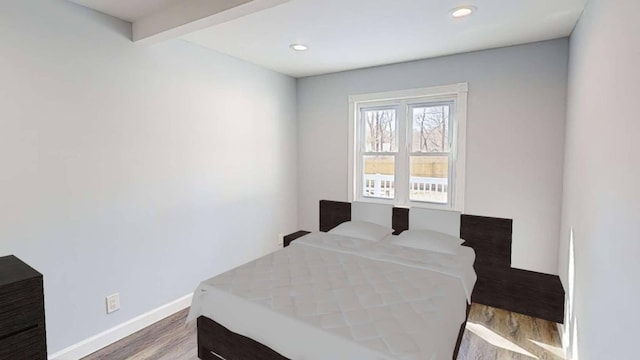 bedroom featuring recessed lighting, wood finished floors, and baseboards