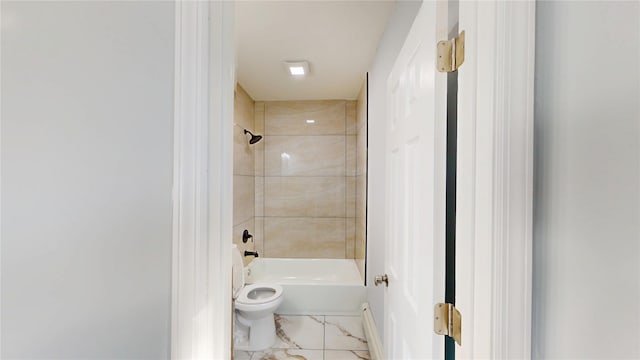 full bathroom with toilet, marble finish floor, and tub / shower combination