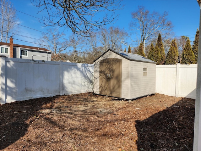 view of shed featuring a fenced backyard