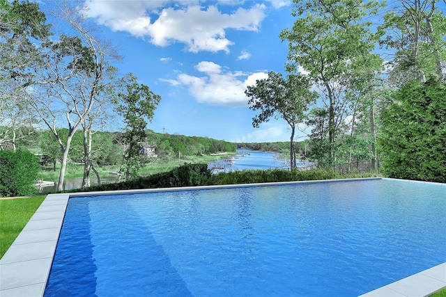 view of pool featuring a water view and an infinity pool