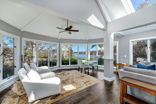 sunroom with lofted ceiling with skylight and a ceiling fan