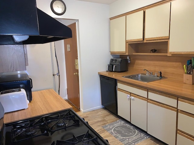 kitchen featuring black dishwasher, range, light wood-style floors, a sink, and exhaust hood