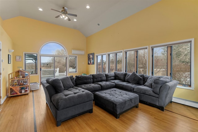 living room with a wall unit AC, light wood-style flooring, high vaulted ceiling, and recessed lighting