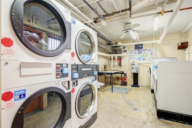 shared laundry area with a ceiling fan, stacked washer / dryer, and washing machine and clothes dryer