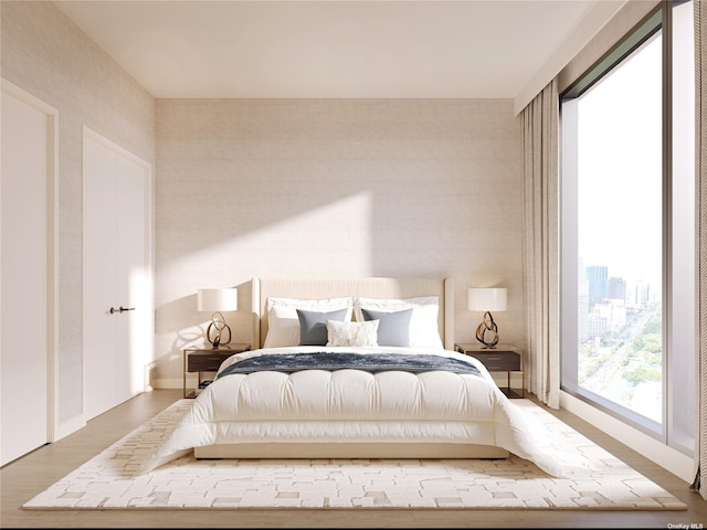35-32 Leavitt St Unit Ph G, Flushing, NY 11354 - bedroom with wood finished floors and wallpapered walls