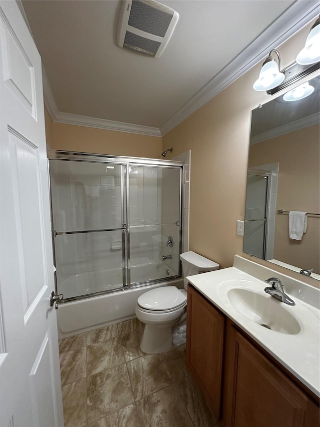 bathroom with crown molding, bath / shower combo with glass door, visible vents, toilet, and vanity