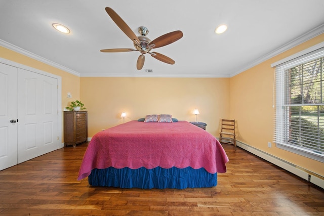 bedroom featuring crown molding, a baseboard radiator, and wood finished floors