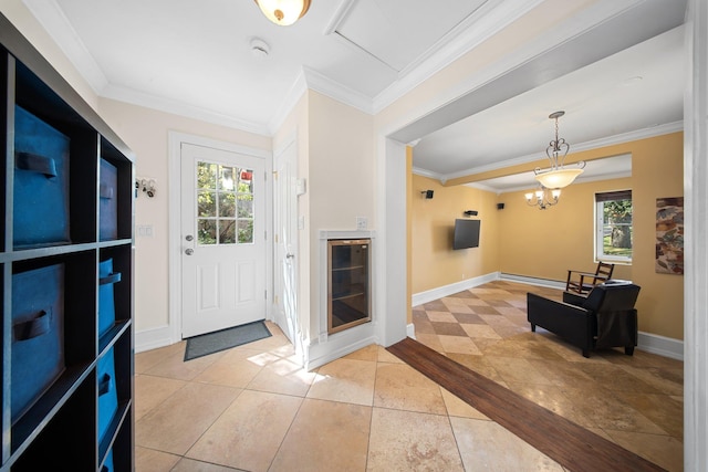 foyer entrance featuring baseboards, ornamental molding, light tile patterned floors, and a baseboard radiator