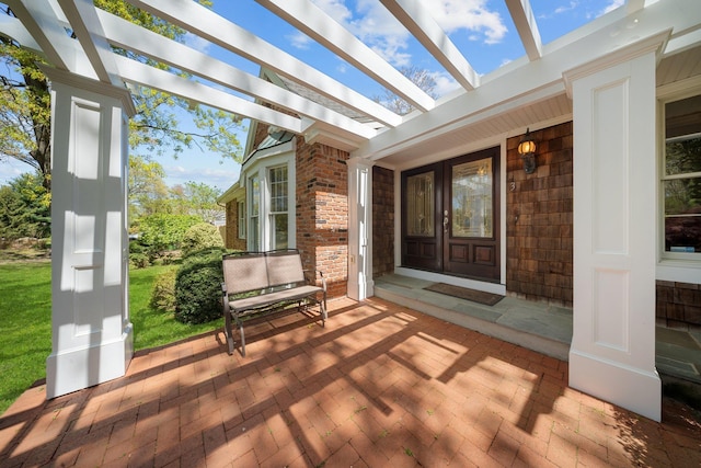 wooden deck with french doors and a pergola