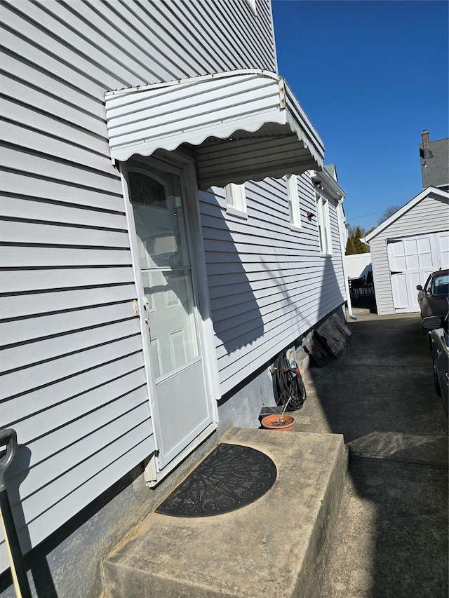 exterior space featuring a shed and an outbuilding