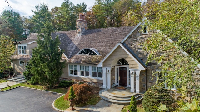 view of front facade with a chimney