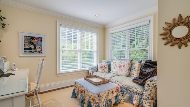 living area with ornamental molding, wood finished floors, and baseboards