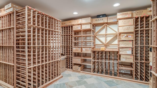 wine cellar featuring stone finish flooring and recessed lighting