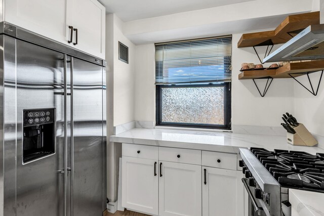4705 Henry Hudson Pkwy W Unit 7G, Bronx, NY 10471 - kitchen featuring open shelves, visible vents, appliances with stainless steel finishes, and white cabinets