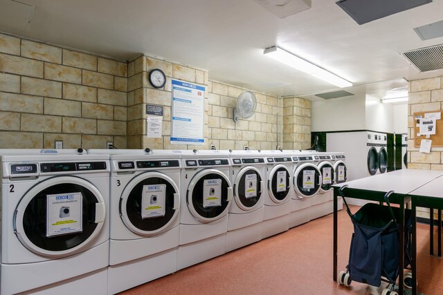 4705 Henry Hudson Pkwy W Unit 7G, Bronx, NY 10471 - common laundry area featuring washing machine and clothes dryer and visible vents