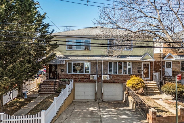 view of front of house featuring a garage, brick siding, driveway, and fence