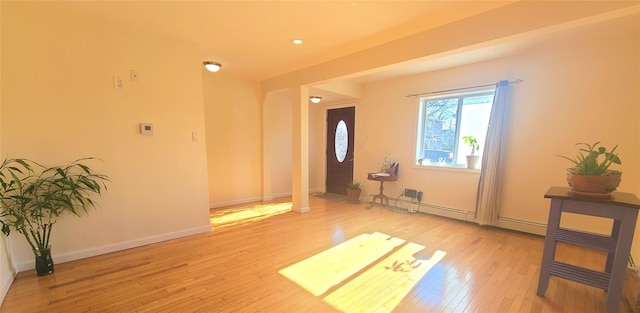 interior space with light wood-style flooring and baseboards