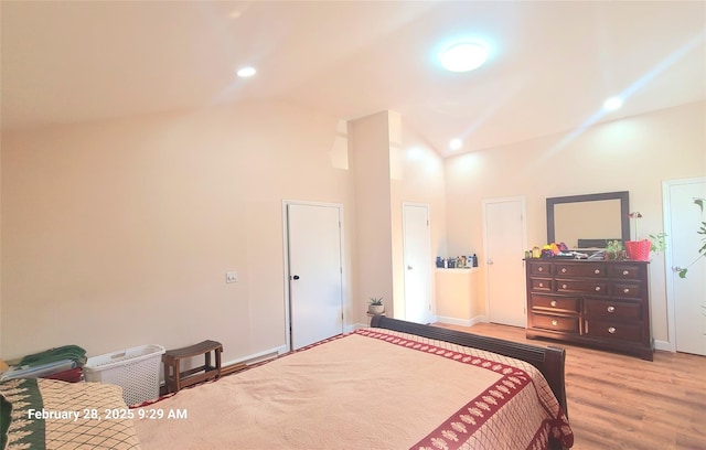 bedroom with baseboards, high vaulted ceiling, wood finished floors, and recessed lighting