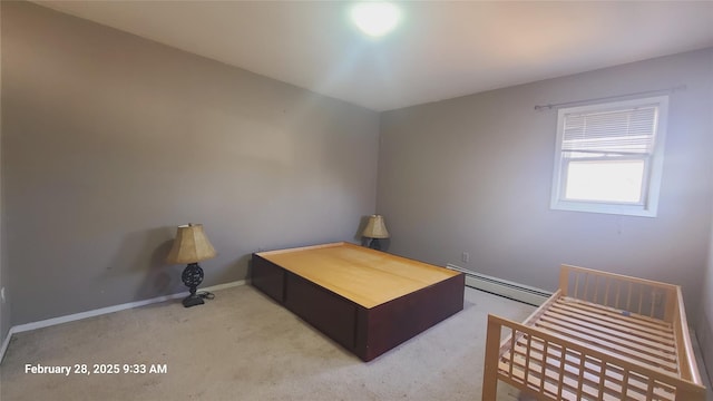 unfurnished bedroom featuring carpet, baseboards, and baseboard heating