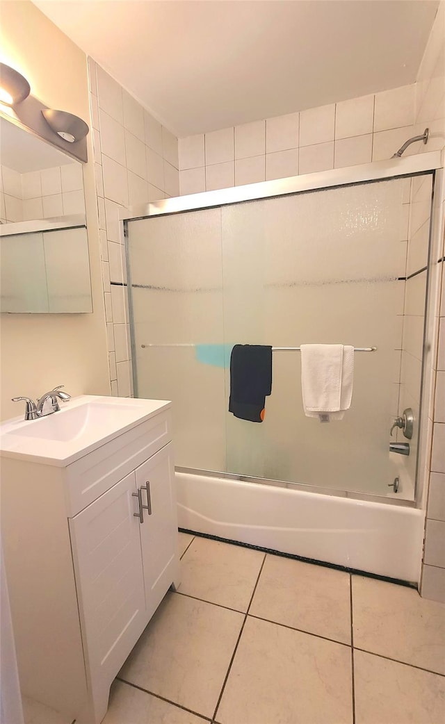 bathroom featuring bathing tub / shower combination, vanity, and tile patterned floors