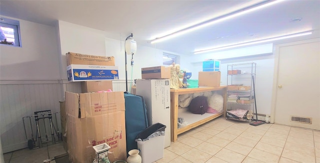 storage room with a baseboard radiator and visible vents