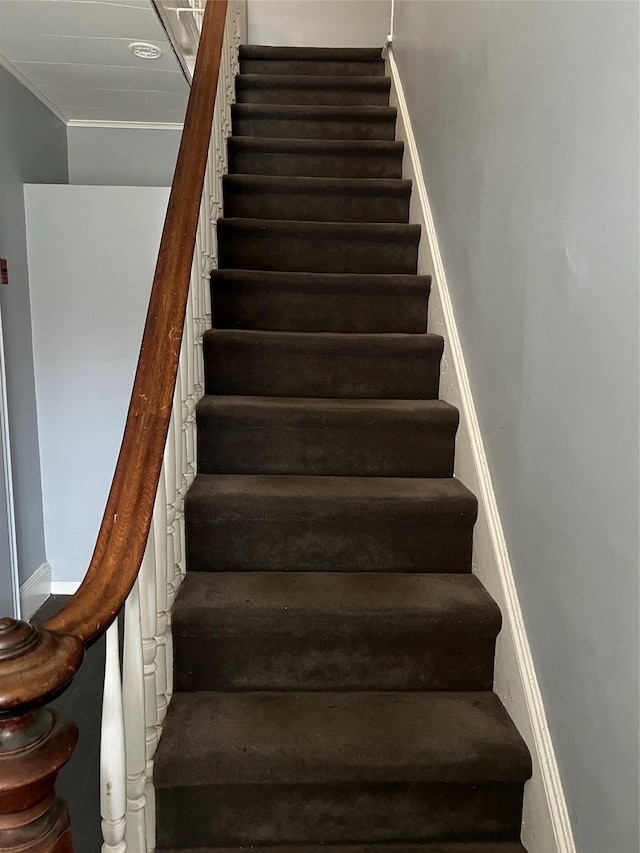 stairs featuring ornamental molding