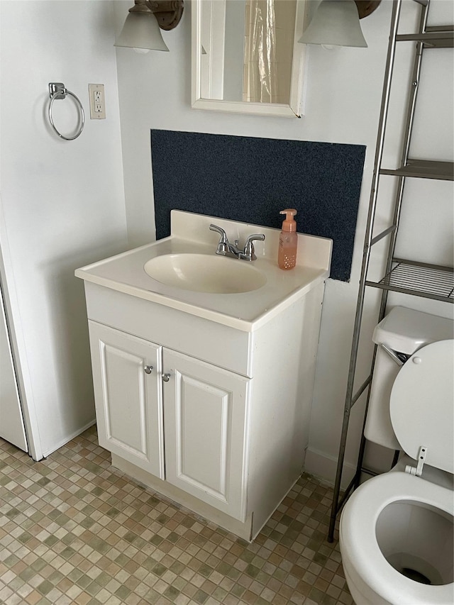 bathroom with vanity and toilet